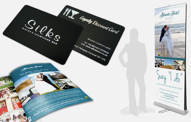 A collection of 3 parts, first, A visual example of an advertisement in a brochure for the Atlantic hotel. next, The black Silks restaurant loyalty card back and front. lastly, Signage roller banner for a wedding advertisement..