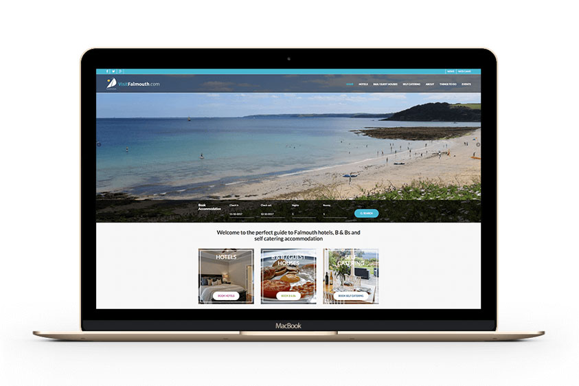 The Visit Falmouth website design on a laptop. Designed and built by Oracle Design