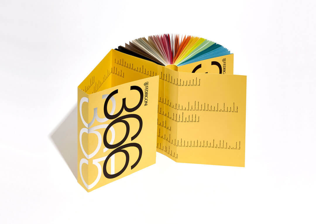 The Fedrigoni 366 brochure opened and showed the cover and the rainbow of coloured pages.