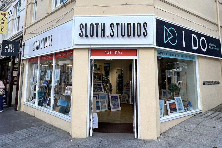 The small side black and white Sloth Studios external sign, the I Do external sign and the main above entrance external sign. The logo and brand design by Oracle Design.