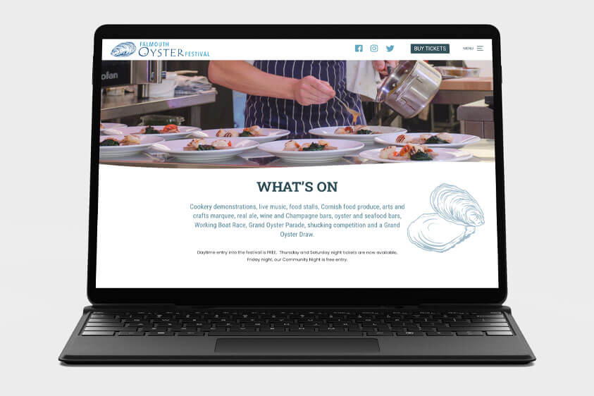 A laptop screen showcasing how the Falmouth Oyster Festival website looks on this device. The design and build of the website were created by Oracle Design